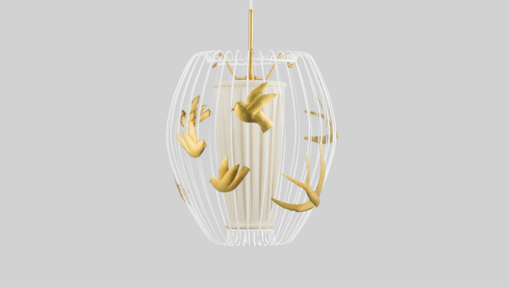 Lampa med mässingsfåglar mot grå bakgrund.